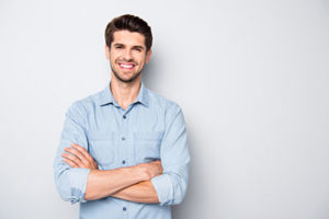 man smiling with arms crossed, about lovett dental baytown