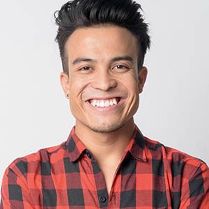 man in plaid smiling