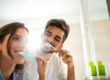 couple brushing teeth, how to prevent tooth decay naturally