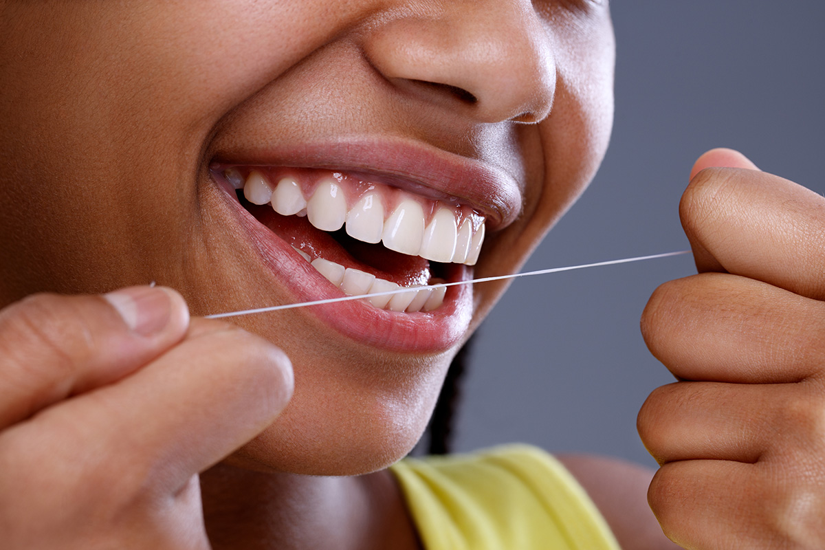 benefits of flossing daily (5) individual showing the benefits of flossing daily