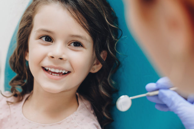 dentists open on saturday (2) child smiling at dentists open on saturday