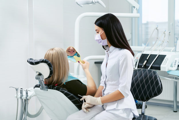 treating a chipped tooth (2) dentist treating a chipped tooth in patient