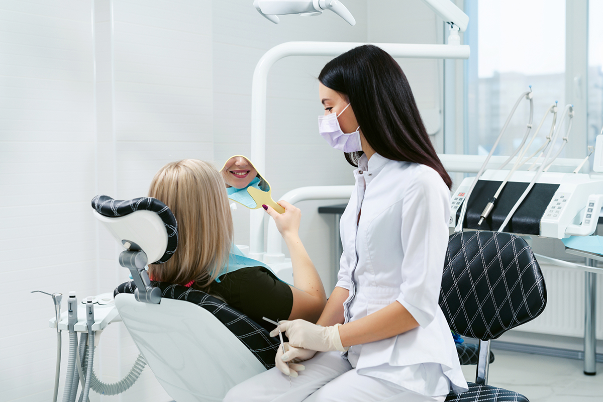 treating a chipped tooth (2) dentist treating a chipped tooth in patient