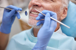 man getting dental exams