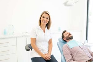 dentist sitting next to patient for preventative dentistry