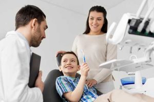 mother and son learning about family dentistry 