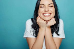 woman smiling after teeth whitening services