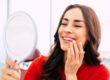 patient looking at her dental implant